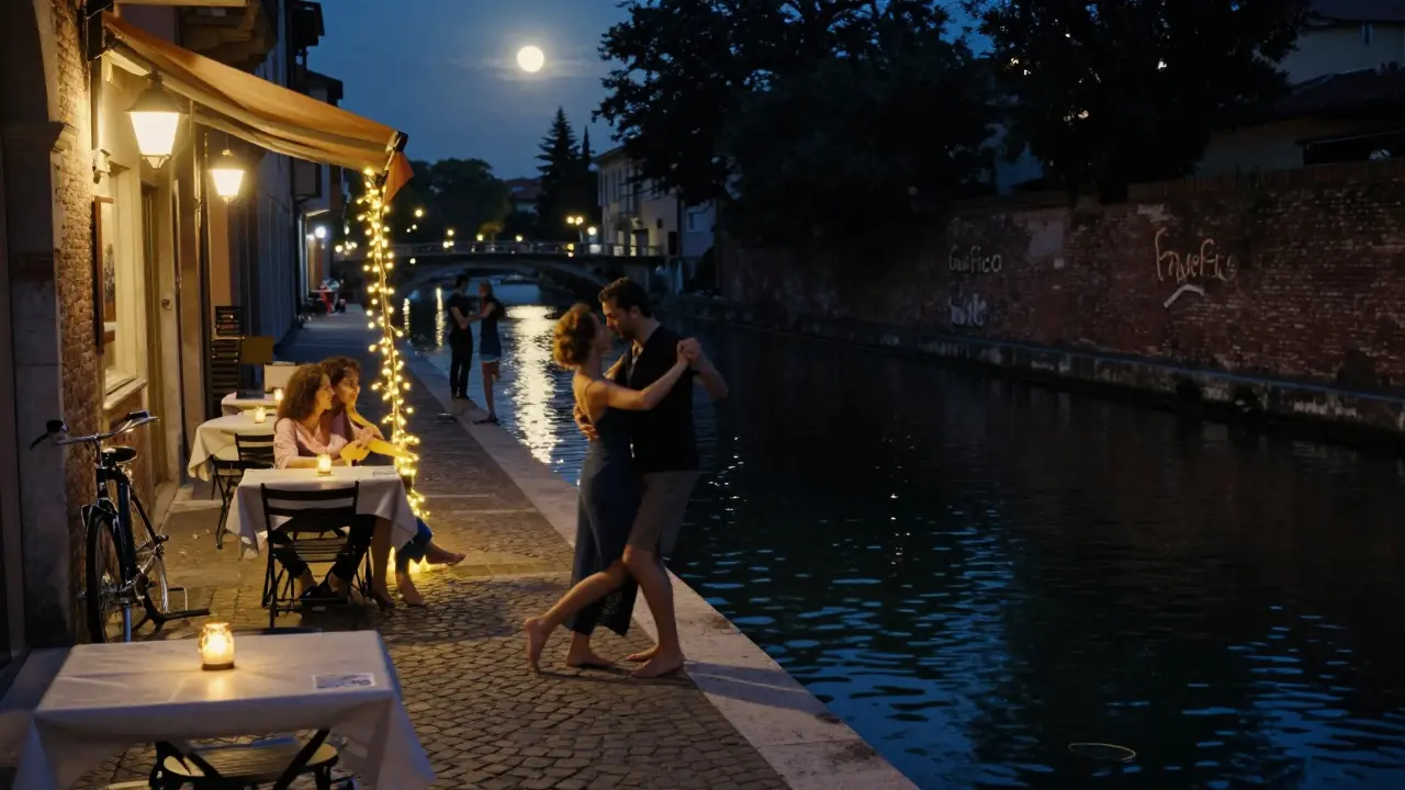 Canal-side bars in Navigli at night with people dancing by the water under lantern lights.