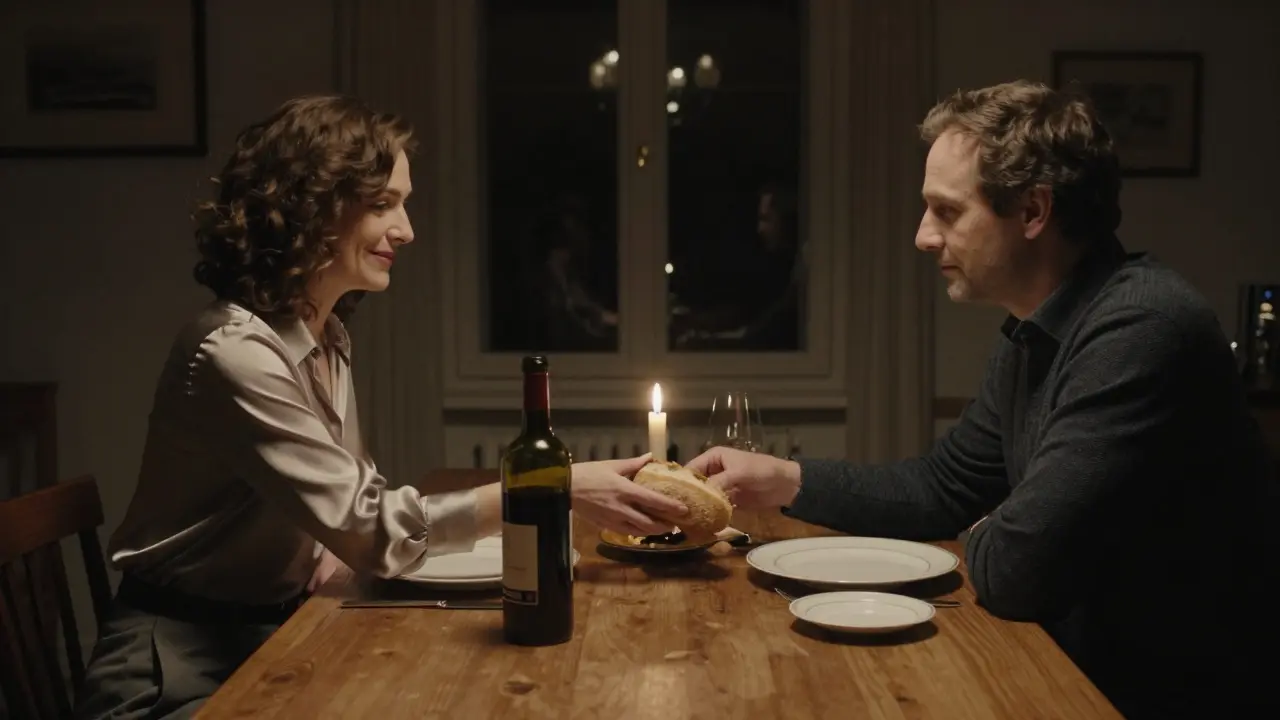 A candlelit dinner with two people at a quiet table, sharing food in a discreet private dining room.